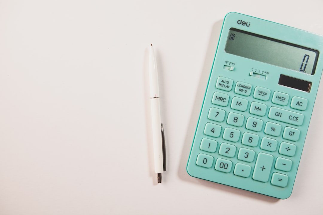 Person reviewing debt settlement options on laptop — Pro-Settle DIY platform